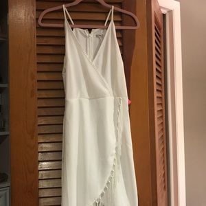 White wrap dress with fringe hem